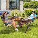 Portable brown picnic table made of bamboo, set up for outdoor dining with two chairs in a garden setting.